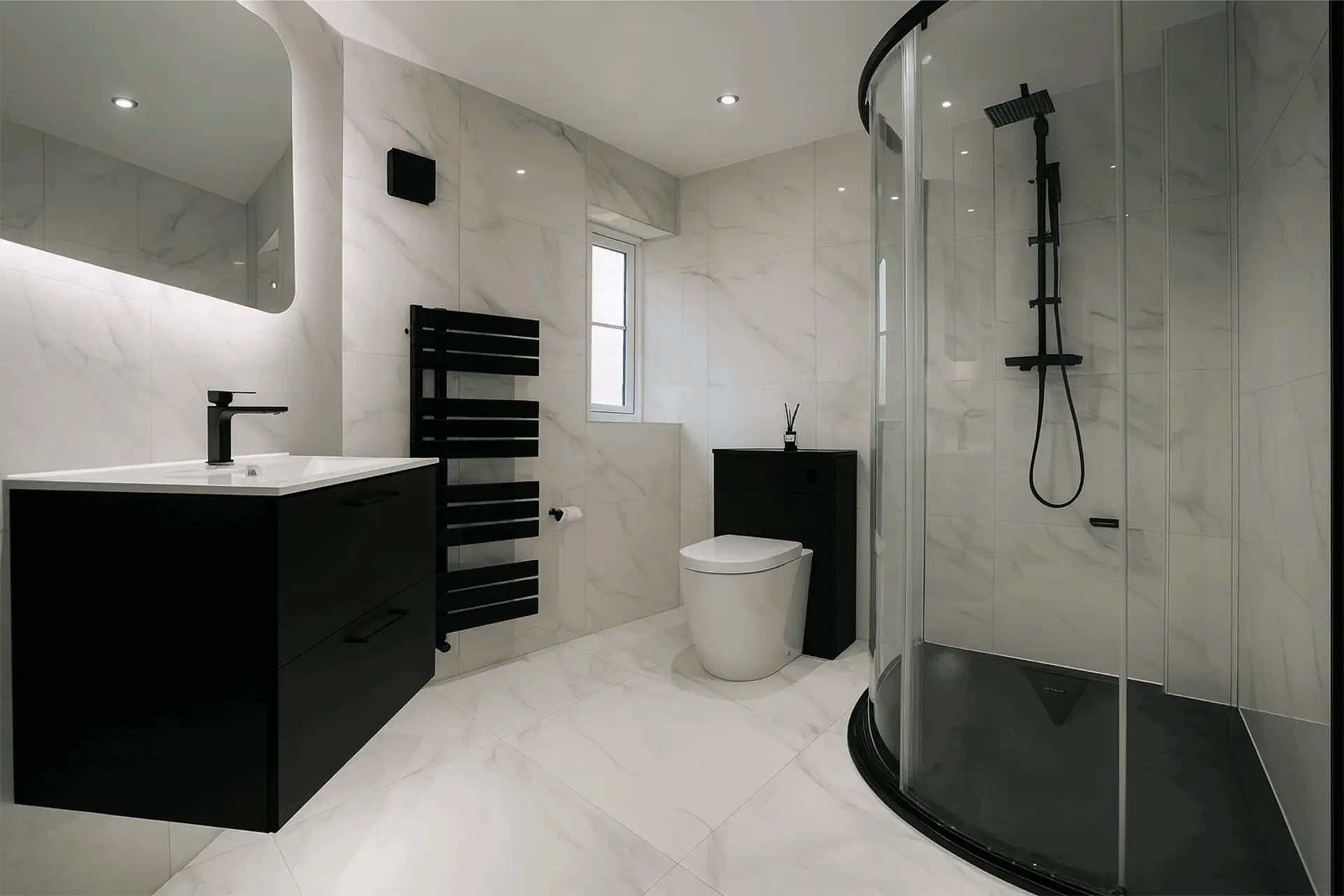 Modern monochrome bathroom with marble-effect tiling, black vanity, LED mirror and quadrant shower enclosure